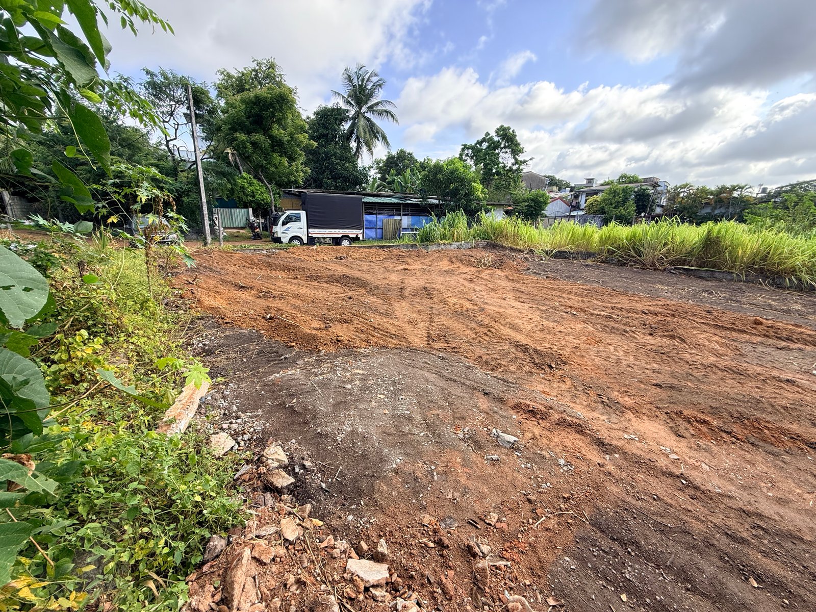 Ground-level view across the compact residential plot in Boralesgamuwa
