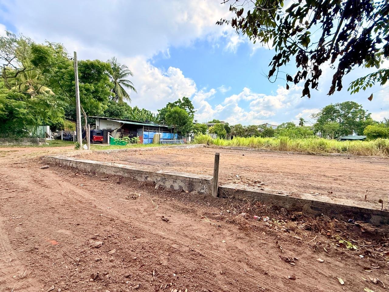 Ground-level view across the compact residential plot in Boralesgamuwa