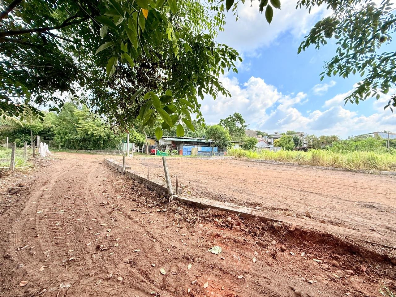 View of the cleared Boralesgamuwa land with its boundary and adjacent access road
